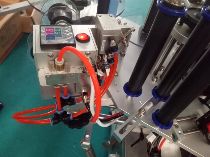 Гурван эсвэл хоёр талт наалт шошголох машиныг кодчилох машинаар тохируулсан